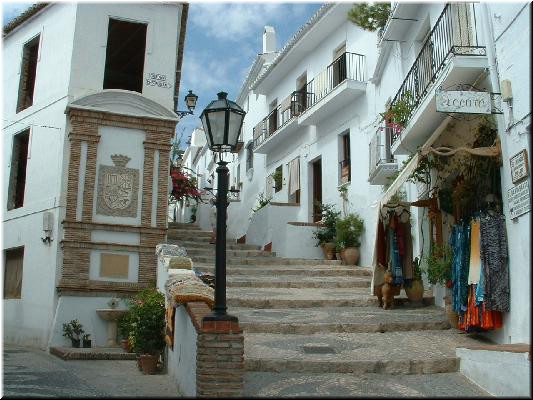 Main street continues to the left. TThe stepped street to right is steeper but shorter route to our villa.  Also, no cars.