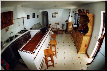 Our villa, main living area. When we were there, the hutch had been replaced by another couch.